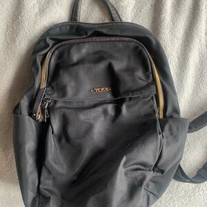 Medium size women’s Tumi backpack purse